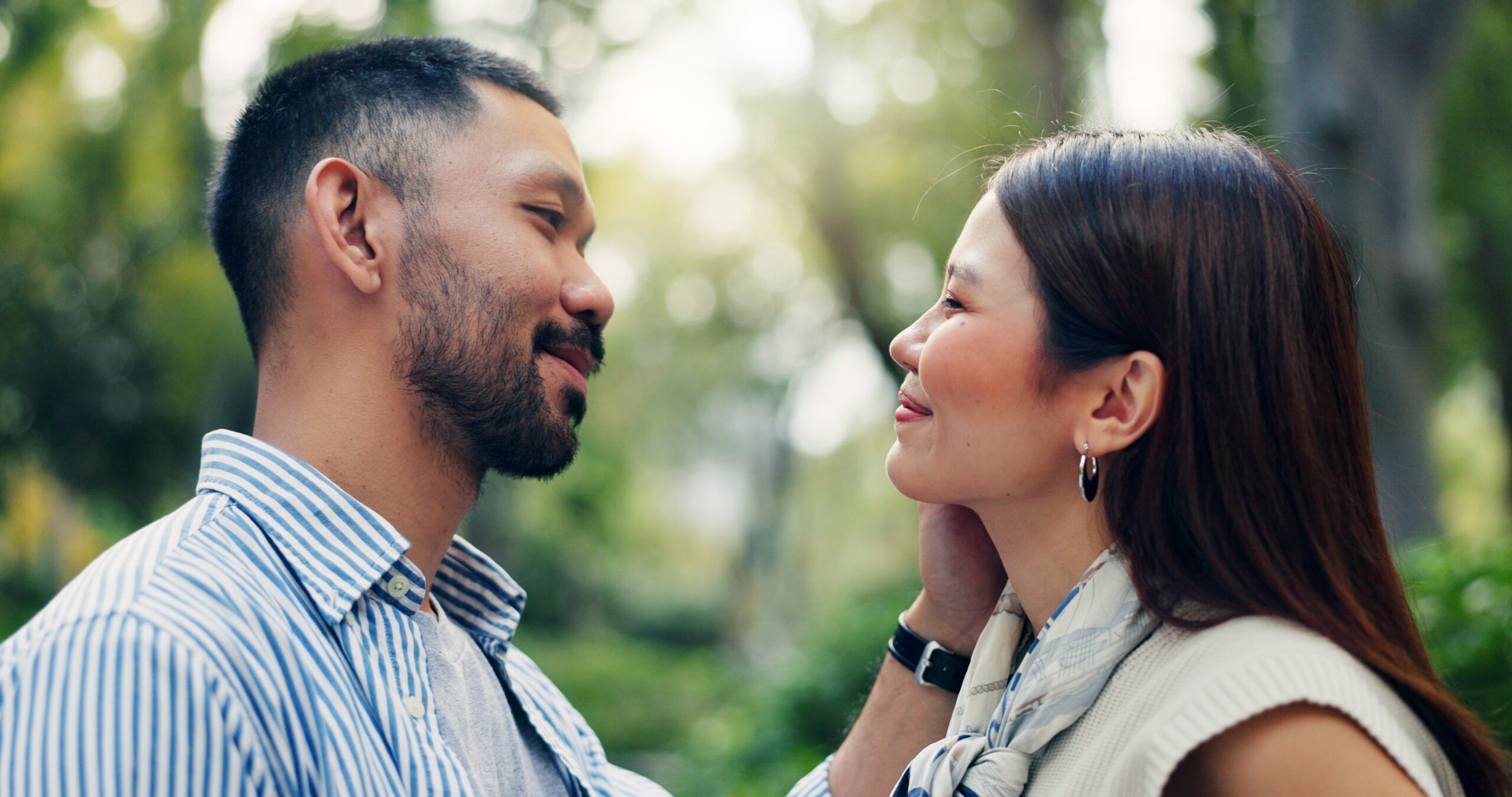 Couple in warm embrace outdoors, representing successful recovery and a stronger, more fulfilling relationship after completing infidelity counseling.